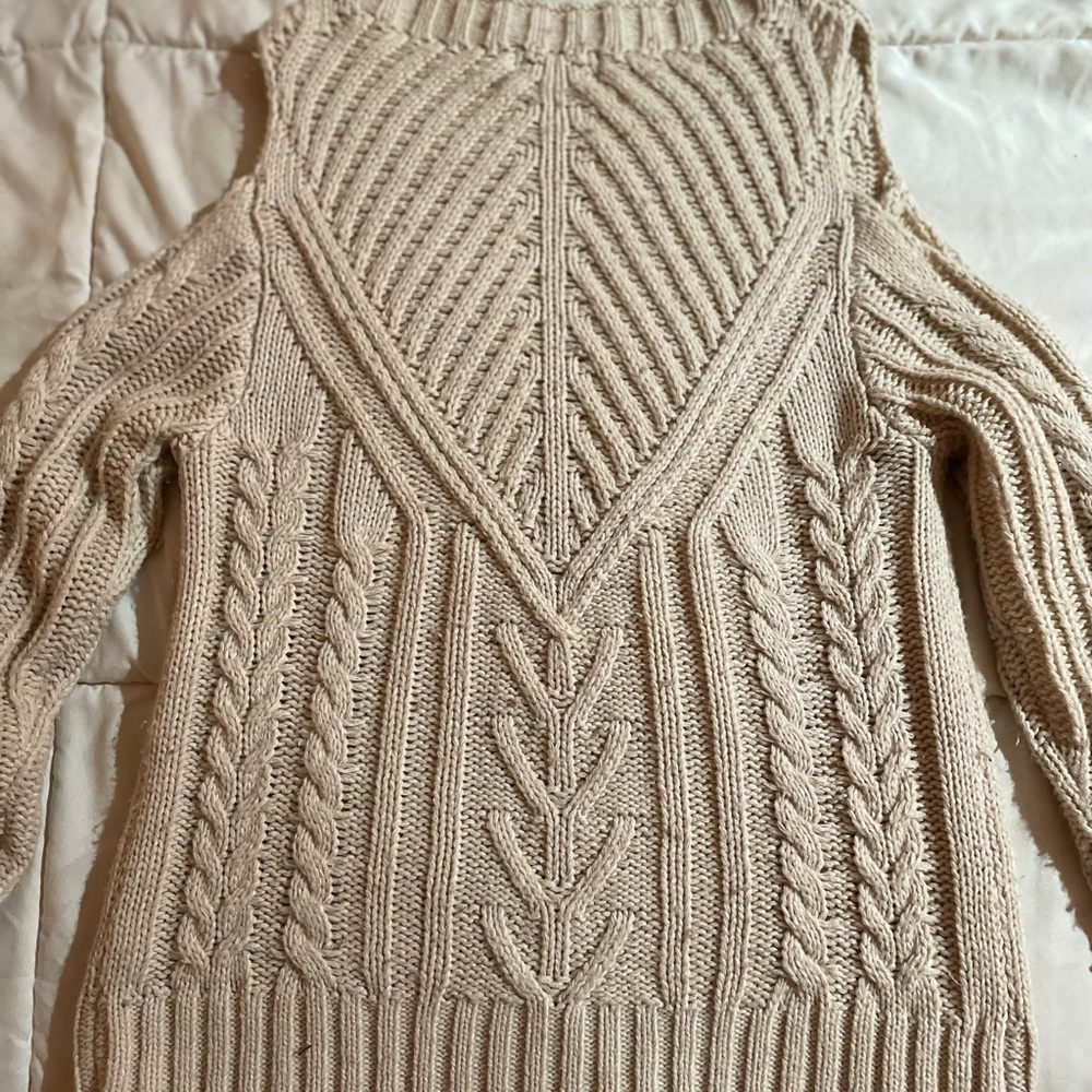 Cream shoulder cut sweater.
